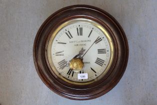 20th Century Continental oak circular wall clock with painted dial having Roman numerals