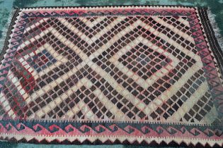 Small Kelim rug with a twin medallion design, in shades of rose, pink, beige and brown, 20cms x