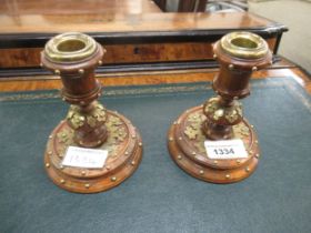 Pair of late 19th / early 20th Century walnut dwarf candlesticks with brass mounts, 12cm high