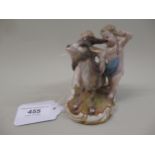 Meissen group of two putti with a goat, 9.5cm high Various areas of restoration to hands, goat's