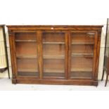 Good quality Victorian figured mahogany dwarf bookcase, the moulded top above three rectangular