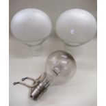 Two large clear and etched glass light shades in the form of large light bulbs, 39cm high each