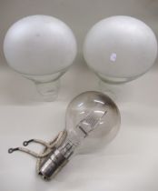 Two large clear and etched glass light shades in the form of large light bulbs, 39cm high each