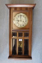 Early 20th Century Continental walnut rectangular wall clock, the silvered dial with Arabic numerals