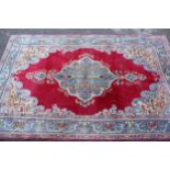 Pair of Indian rugs with a lobed medallion design on a wine ground with borders, 223 x 143cm each