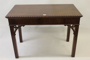 George III rectangular mahogany side table, the carved pie crust top above a shallow frieze,