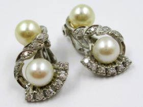 Pair of 14ct white gold cultured pearl and diamond set clip earrings of stylised floral design,