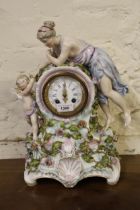 Large 19th Century Continental porcelain mantel clock with a female figure surmount, the enamel dial