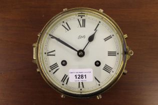 Ship's brass bulkhead clock, the painted dial with Roman numerals signed Schatz, with a two train