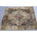 Sparta carpet with a medallion and all-over stylised design, in shades of beige, blue, pink and