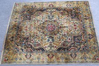 Sparta carpet with a medallion and all-over stylised design, in shades of beige, blue, pink and