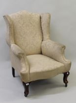 Early 20th Century upholstered wing armchair in Georgian style on mahogany cabriole supports