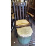 20th Century oak slatted open armchair with drop-in rush seat, a small Lloyd Loom linen basket (at