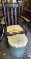 20th Century oak slatted open armchair with drop-in rush seat, a small Lloyd Loom linen basket (at