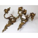 Pair of French ormolu rococo style two branch wall lights