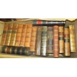 Three boxes containing a large quantity of miscellaneous leather bound books