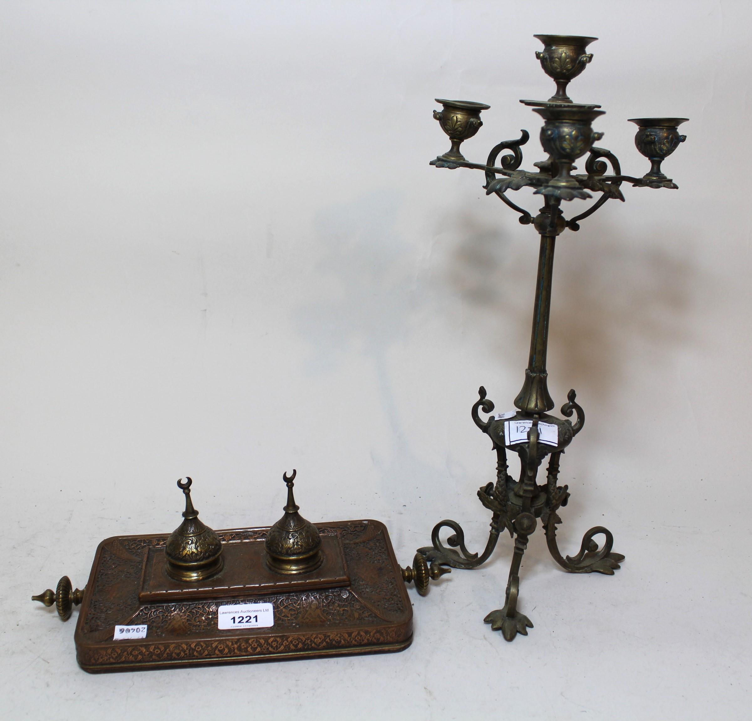 Middle Eastern copper and brass two bottle inkstand, together with a brass four branch candelabra