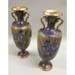 Pair of early 20th Century Carlton Ware floral decorated two handled vases in blue and gilt, 31cm