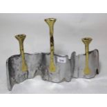 David Marshall, bi-metal three light candle holder in stylised form