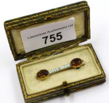 Gold, citrine and enamel brooch by Carlo and Arthur Giuliano, 37mm wide, in fitted case We are not