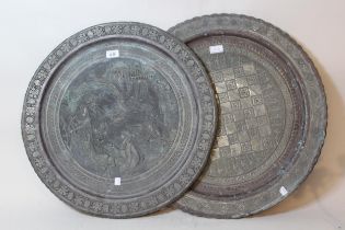 Indian brass circular charger decorated in relief with figures in a landscape, 57cm diameter