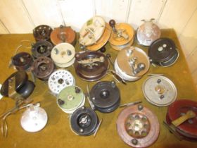 Allcock Aerialite surf reel, together with two similar reels by Charles Alvey and a quantity of