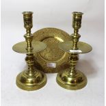 Pair of antique brass knopped stem candlesticks with wide drip trays, 25cm high together with an