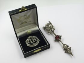 King George VI marcasite coronation brooch, together with a paste set arrow brooch