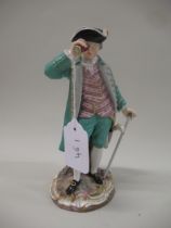 Meissen figure of a gentleman wearing a green tunic and breeches looking through a telescope and