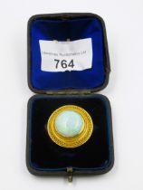 Victorian Etruscan revival opal brooch, the unmarked high carat gold mount of circular stylised
