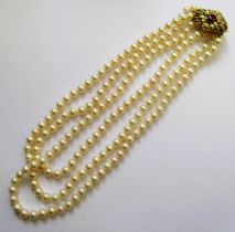 Triple row cultured pearl necklace with 14ct gold ruby and diamond clasp (the clasp removable to