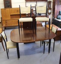 Mid 20th Century G Plan teak Librenza Tola dining table by E Gomme, and four chairs with black