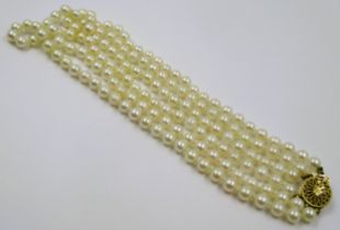 Triple row cultured pearl necklace with 9ct gold clasp