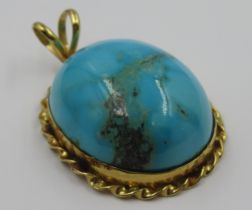 Turquoise yellow metal mounted pendant with marks (possibly Egyptian)