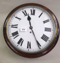 Late 19th / early 20th Century mahogany circular wall clock, the painted dial with Roman numerals