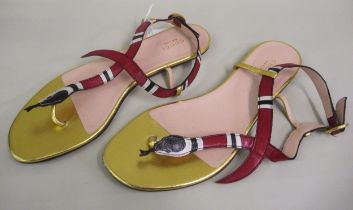 Gucci, pair of flat leather sandals, the top in the form of a snake, size 39, with original dust bag