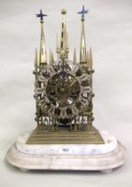 19th Century brass Gothic Revival skeleton clock, the pierced silvered dial with Roman numerals, the