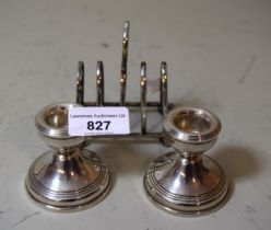 Pair of Birmingham silver dwarf candlesticks, together with a plated toast rack