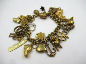 9ct Yellow gold charm bracelet mounted with various charms 49.7g