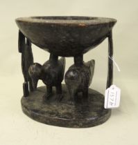 Nigerian Yoruba tribe carved wooden pedestal bowl with stylised figures of birds to the base, 19cm x