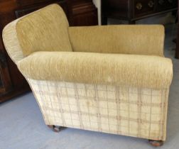 Gentleman's late 19th Century library armchair with loose cushion, on bun supports with original