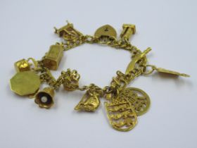 9ct Gold charm bracelet with a collection of various charms, 30.5g