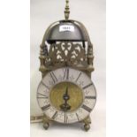 19th Century brass lantern clock, the silvered dial with Roman numerals and indistinct signature,