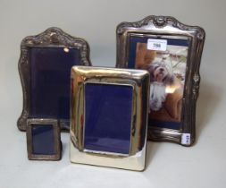 Group of four various modern silver photograph frames, the largest 25 x 17.5cm