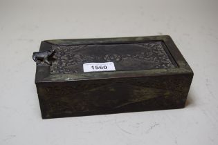 Asian green and dark patinated bronze rectangular box, the sliding relief decorated cover with