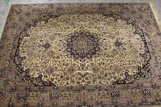 Mid 20th Century Indo Persian carpet with a medallion and all-over stylised floral design on an