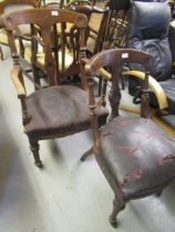 Victorian slope back armchair with leather seat, together with another similar chair