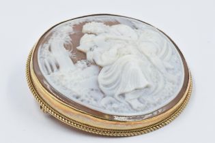 Circular 9ct gold mounted carved shell cameo brooch, depicting 'The Lovers', 46mm diameter