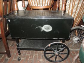 Mid 20th Century ebonised drop-flap two tier tea trolley