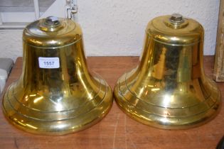 Two 20th Century brass bells, 18cm high
